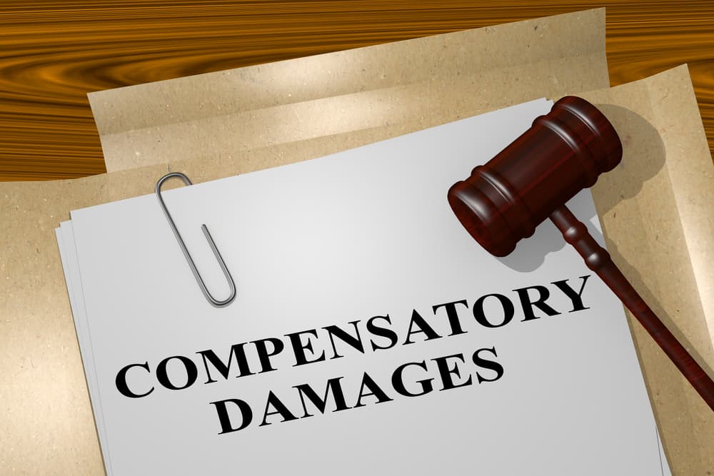 illustration of "COMPENSATORY DAMAGES" title on legal document