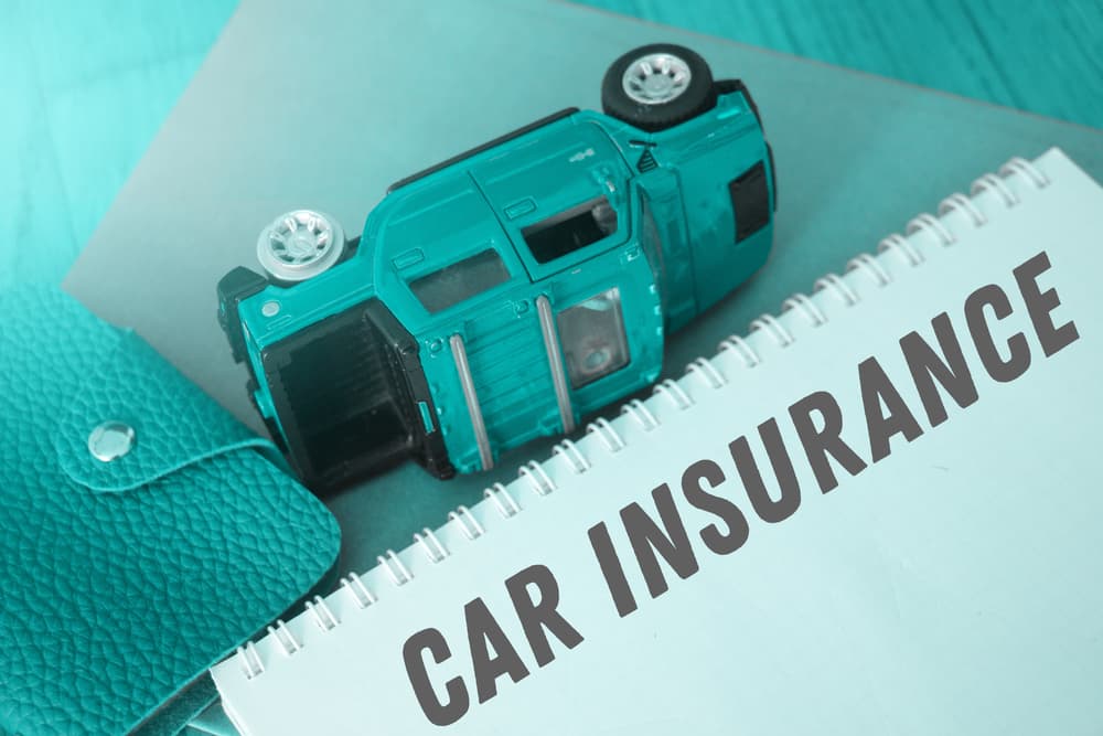 Word writing 'Car Insurance' on a white background. Business concept for comprehensive coverage, accident protection, and motor vehicle guarantees.